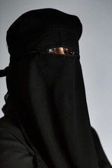 Muslim arab woman with black niqab