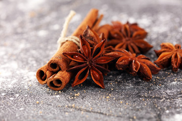 cinnamon and staranise winter spices on rustic background