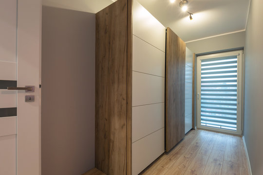 Interior of a modern house with wooden wardrobe