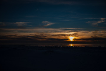 Fototapeta premium frozen sea side beach in winter with lots of ice and snow
