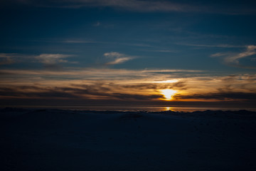 frozen sea side beach in winter with lots of ice and snow