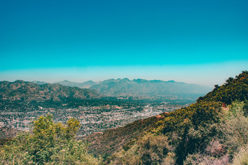 Fototapeta na wymiar View of City Beneath Mountains