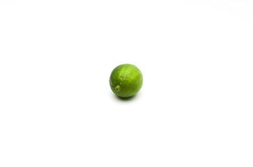 Fresh whole lime isolated on white