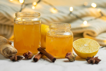Homemade ginger and lemon jam on a light background, close-up. Natural products to support the immune system in the winter. Phytotherapy. Healthy food, health status report
