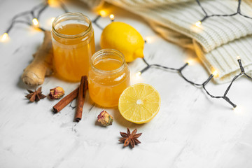 Homemade ginger and lemon jam on a light background, close-up. Natural products to support the...