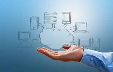 Businessman in suit with cloud signs on background