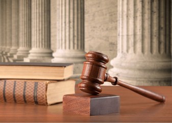 Close up lawyer with gavel judge and books