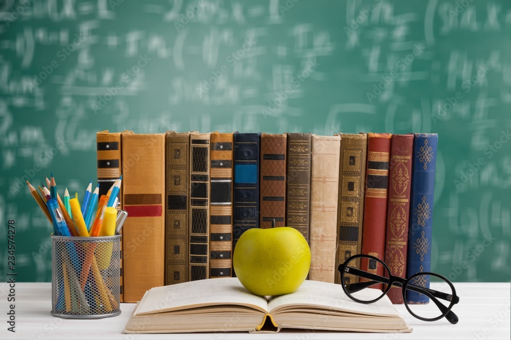 Wall mural Stack of Books on A Desk for Back to School