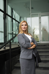 Smiling Female Business Leader With Arms Crossed