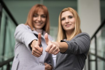 Business woman shows thumb up