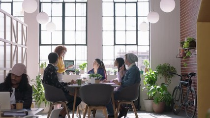young business people celebrating successful project creative team high five in office meeting enjoying diverse teamwork