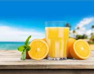 Orange juice and slices of orange on background © BillionPhotos.com