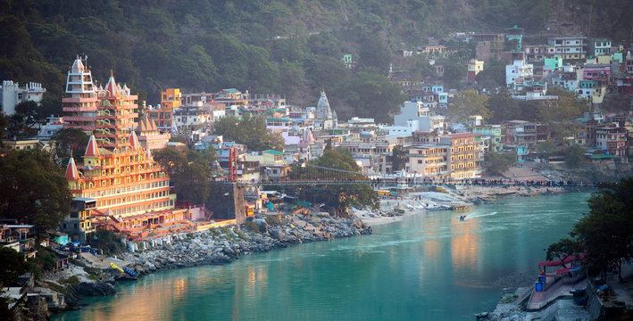 Spectacular view of the Lakshman Temple bathed by the sacred Ganges river at sunset. 