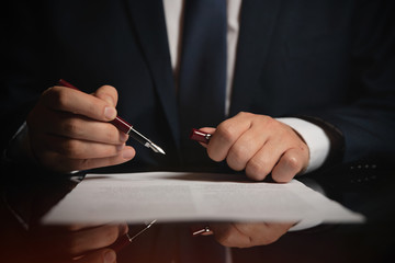 Lawyer, attorney signing a contract