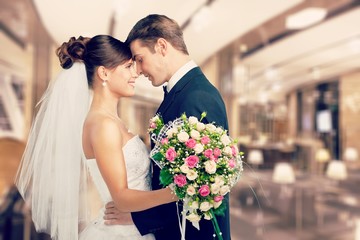 Portrait of a smiling wedding young couple isolated on white
