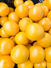 Fresh oranges background closeup