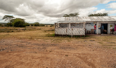 NAIVASHA, KENYA - MAY, 2014: Typical shopping street scene with pedestrians in Naivasha, Kenya