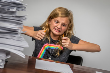 Overwhelmed Girl Frustrated by Homework Snapping Pencil