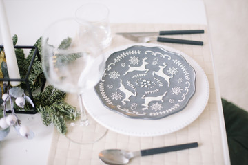 Serving a festive table. New year decorations. Christmas and  New Year concept