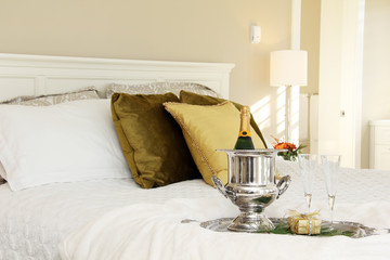 Elegant hotel bedroom with champagne service. 