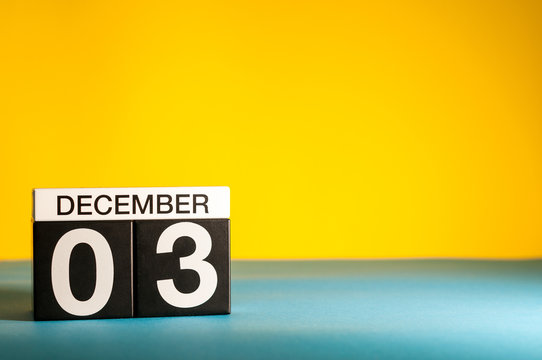December 3rd. Image 3 day of december month, calendar on yellow background. Winter background with empty space for text, mockup