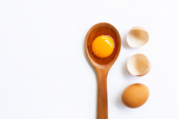 Chicken eggs with yolk on white background.