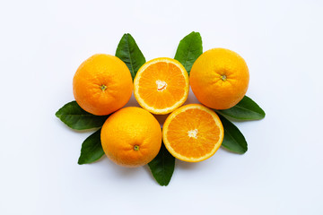 Fresh orange citrus fruit with leaves isolated on white wooden background.  Top view
