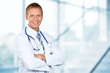 Attractive young female doctor student on background