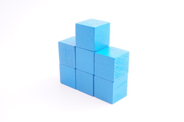 Blue wooden blocks on white background. 