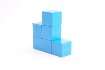 Obraz premium Blue wooden blocks on white background. 