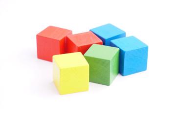 Obraz premium Colorful wooden cube isolated on white background.