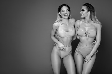 Beautiful sexy twins sisters having fun together