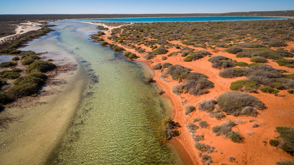 Oblique aerial view from drone of tidal creek near Denham in the World Heritage Listed Shark Bay Area.