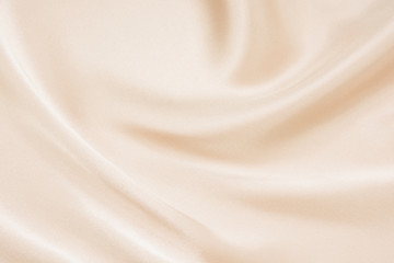 Naklejka premium The texture of the satin fabric of beige color for the background