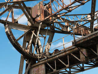 Naklejka premium Old, rusty, dilapidated metal loading winch in the port. 