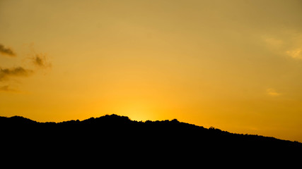 yellow sky black island shadow with clear sky when sunrise on karimun jawa