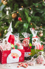 Christmas and New year gifts and baskets with sweets, alcohol, chocolate and cookies