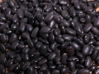 Raw uncooked black beans closeup macro detail view