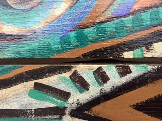 Painted tribal pattern on wood texture for interesting backgrounds.