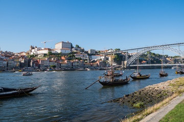 Cityscape of Porto, Portugal with traditional boats on River Douro