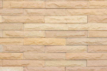 Seamless Grey pattern of decorative brick sandstone wall surface with concrete of modern style design decorative uneven have cracked realmasonry wall of multicolored stones or blocks with cement.