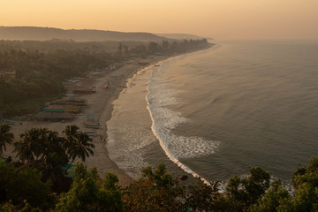 Arambol beach in dawn. Early morning time. Mountain view.
