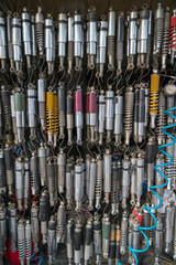 Many old shock absorbers hanging at a repair shop on Hanoi street, Vietnam