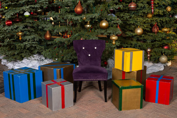 Empty Chair with Christmas Trees and Presents