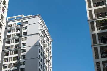 Modern apartment buildings on a sunny day with a blue sky. Facade of a modern apartment building
