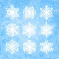 White snowflakes silhouettes isolated on abstract vector backgro