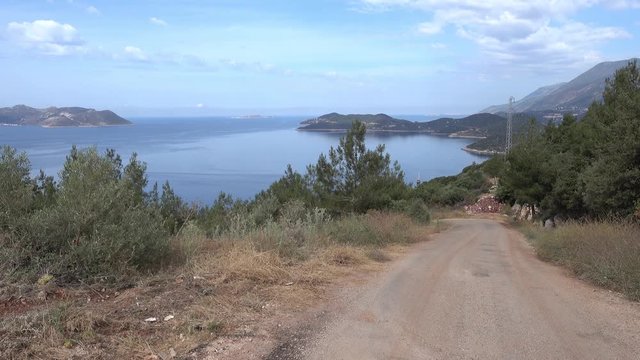 4K Country road downhill to the sea