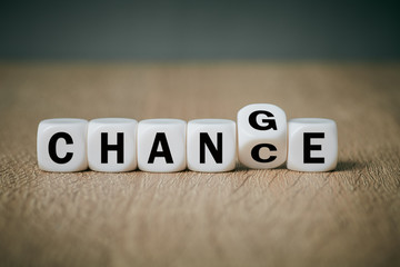 White cube close up on the surface with creative word