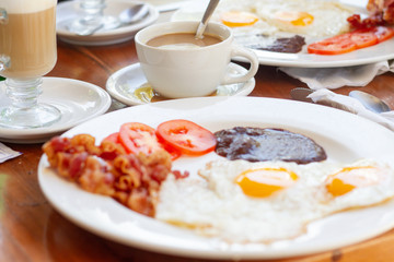 breakfast table with eggs and coffee