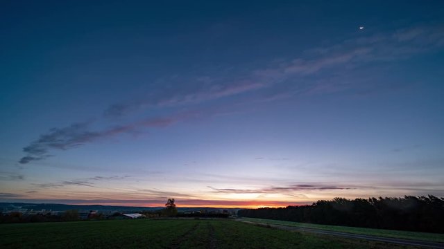 time lapse of sunrise at cloudy weather
